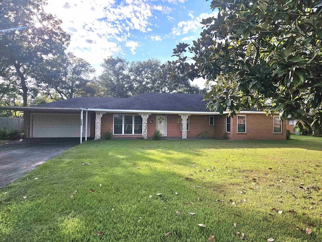 ranch-style home with a garage and a front yard