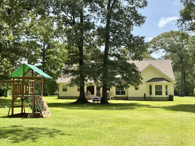 15590 S Fm 92, Spurger, TX 77660 - back of property with a playground and a lawn