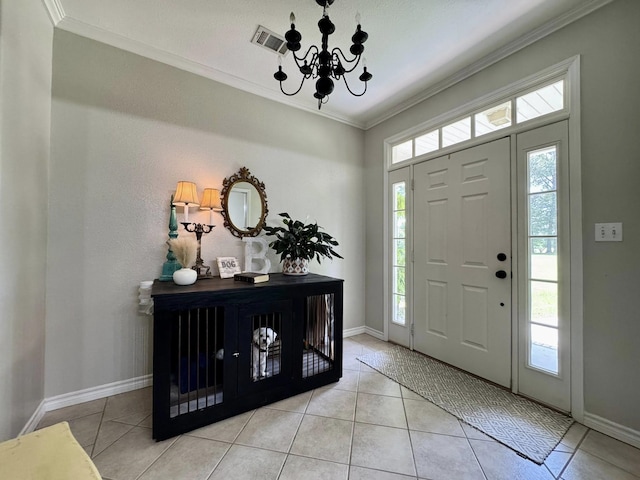 15590 S Fm 92, Spurger, TX 77660 - entrance foyer with ornamental molding, a chandelier, and light tile patterned floors
