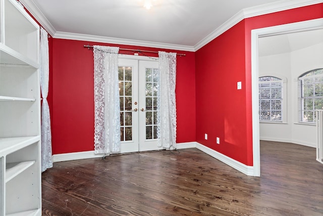 unfurnished room featuring a wealth of natural light, french doors, dark wood-type flooring, and ornamental molding