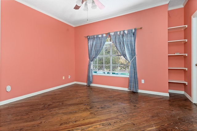 empty room featuring crown molding, ceiling fan, and dark wood-type flooring