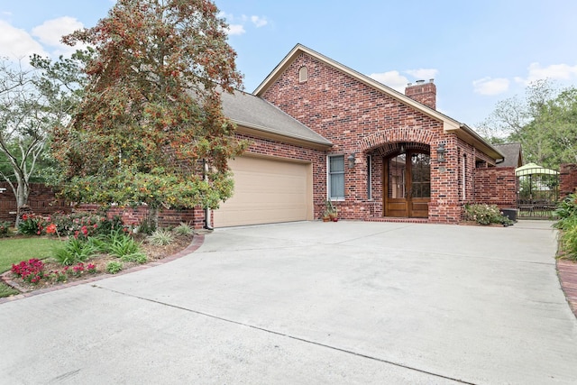 view of front of property featuring french doors and a garage