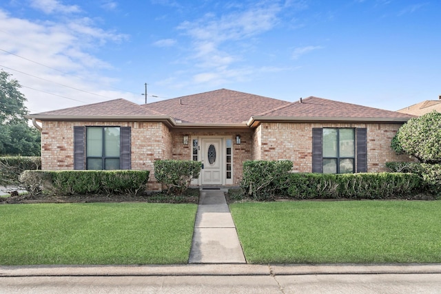 1 Cheska Holw, Beaumont, TX 77706 - single story home with brick siding, a front yard, and roof with shingles