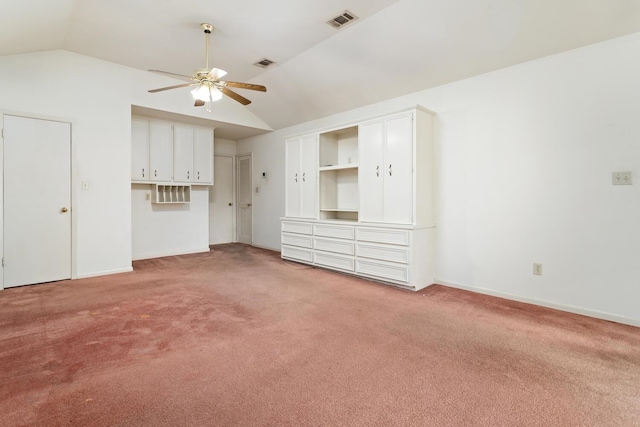 1 Cheska Holw, Beaumont, TX 77706 - unfurnished living room with a ceiling fan, vaulted ceiling, carpet flooring, and baseboards