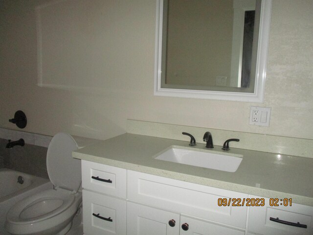 bathroom with vanity and toilet