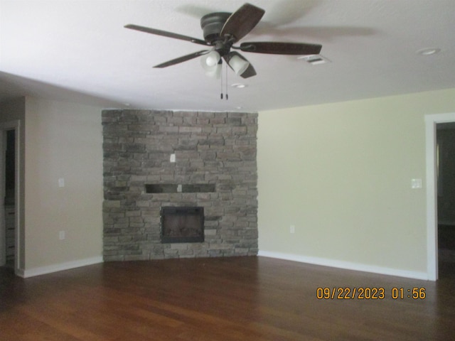 unfurnished living room with a fireplace, hardwood / wood-style floors, and ceiling fan