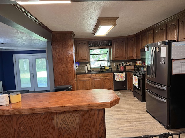 6358 Nick Ave, Port Arthur, TX 77640 - kitchen with stainless steel refrigerator with ice dispenser, gas stove, dishwasher, a textured ceiling, and a sink