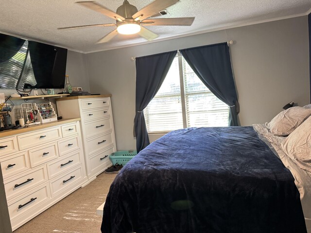 6358 Nick Ave, Port Arthur, TX 77640 - bedroom featuring light colored carpet, a textured ceiling, ornamental molding, and ceiling fan