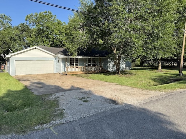 6358 Nick Ave, Port Arthur, TX 77640 - view of front of home with covered porch, driveway, a front yard, and an attached garage