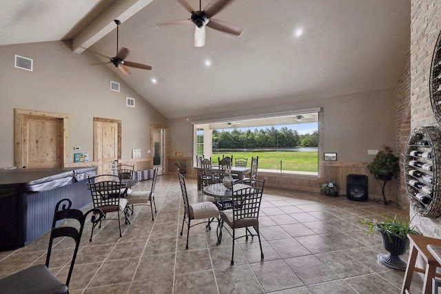 2014 Fish Lk, Kountze, TX 77625 - tiled dining room featuring high vaulted ceiling, ceiling fan, beam ceiling, and visible vents