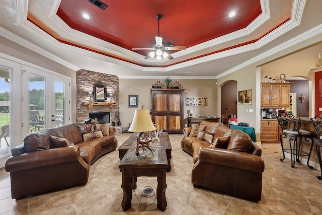 2014 Fish Lk, Kountze, TX 77625 - living room featuring arched walkways, visible vents, ornamental molding, and a raised ceiling