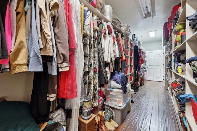 2014 Fish Lk, Kountze, TX 77625 - walk in closet with wood-type flooring and attic access