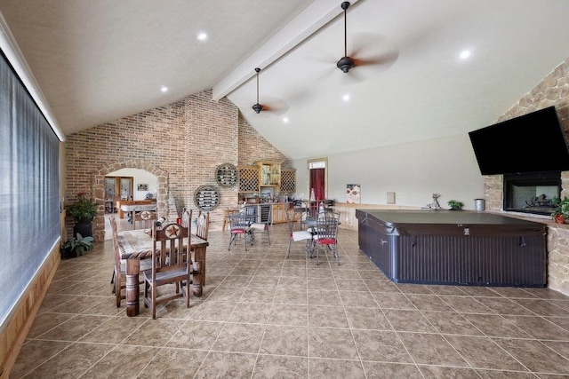 2014 Fish Lk, Kountze, TX 77625 - interior space with ceiling fan, beam ceiling, high vaulted ceiling, and brick wall