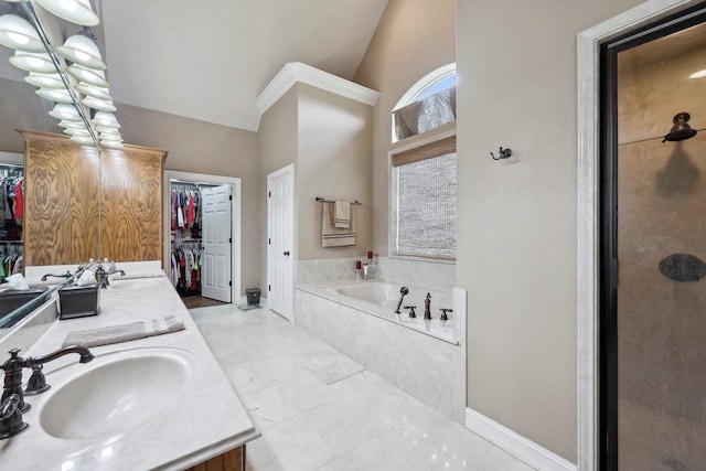 2014 Fish Lk, Kountze, TX 77625 - bathroom featuring double vanity, a sink, a garden tub, and a spacious closet