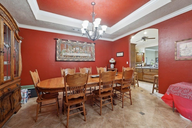 2014 Fish Lk, Kountze, TX 77625 - dining space featuring crown molding, visible vents, a raised ceiling, and ceiling fan with notable chandelier
