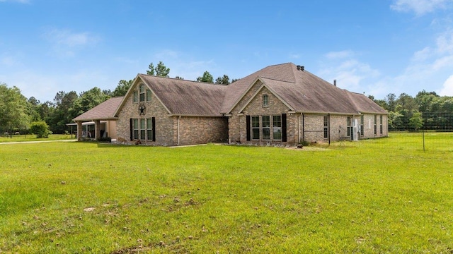 2014 Fish Lk, Kountze, TX 77625 - exterior space with brick siding, roof with shingles, and a front yard