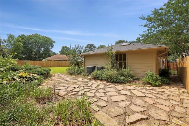 6125 Pinkstaff Ln, Beaumont, TX 77706 - back of house featuring a patio area and central air condition unit