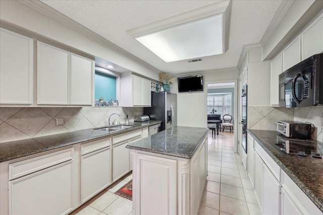 6125 Pinkstaff Ln, Beaumont, TX 77706 - kitchen featuring a sink, black appliances, backsplash, crown molding, and light tile patterned floors