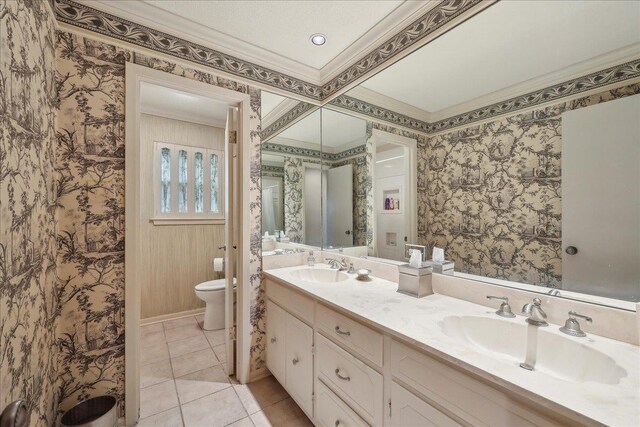6125 Pinkstaff Ln, Beaumont, TX 77706 - full bathroom featuring crown molding, toilet, double vanity, wallpapered walls, and tile patterned floors