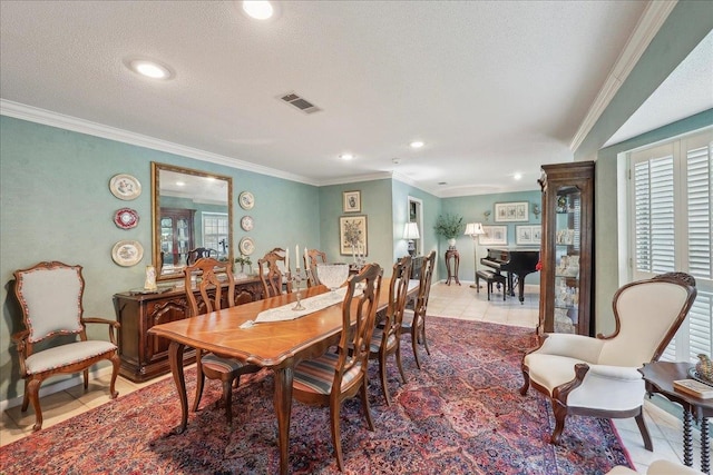 6125 Pinkstaff Ln, Beaumont, TX 77706 - dining space with crown molding, recessed lighting, light tile patterned floors, baseboards, and a textured ceiling