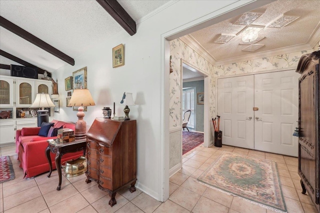 6125 Pinkstaff Ln, Beaumont, TX 77706 - entryway featuring a textured ceiling, light tile patterned floors, crown molding, and wallpapered walls
