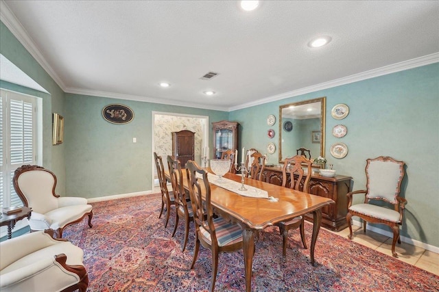6125 Pinkstaff Ln, Beaumont, TX 77706 - dining area with crown molding, baseboards, and recessed lighting