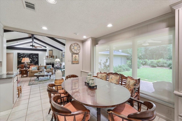 6125 Pinkstaff Ln, Beaumont, TX 77706 - dining area featuring ceiling fan, a textured ceiling, light tile patterned floors, recessed lighting, and a fireplace