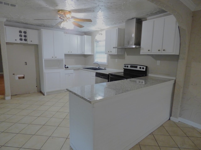 kitchen with wall chimney exhaust hood, light stone counters, range with electric stovetop, kitchen peninsula, and white cabinets