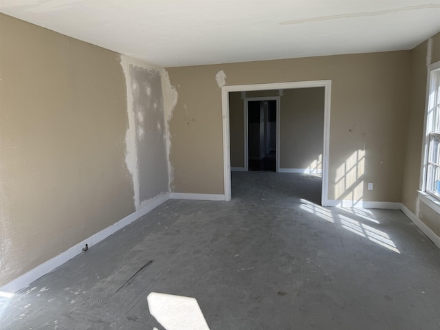 empty room with baseboards