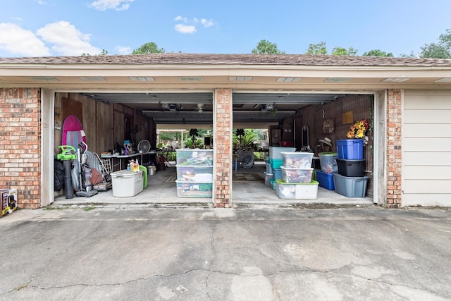 garage featuring aphalt driveway