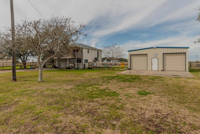 view of yard featuring an outbuilding and a garage