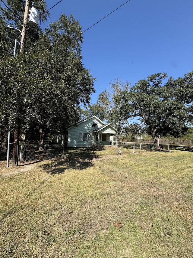 view of yard with a rural view