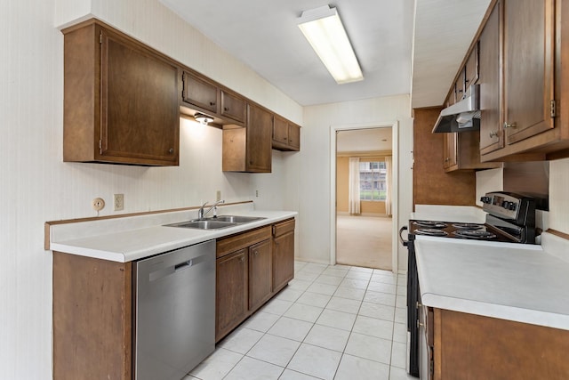 kitchen featuring light tile patterned flooring, a sink, light countertops, stainless steel appliances, and under cabinet range hood
