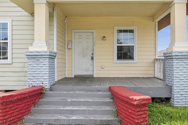 doorway to property with a porch