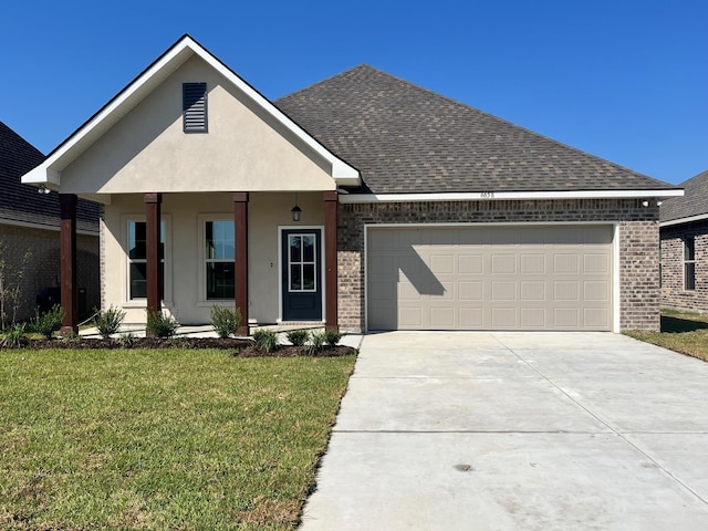 view of front of property with covered porch, a front yard, and a garage