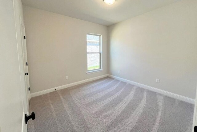 6658 Arbor Way, Orange, TX 77630 - unfurnished room with baseboards and carpet floors