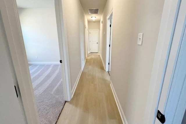 6658 Arbor Way, Orange, TX 77630 - corridor with baseboards, visible vents, and light wood finished floors