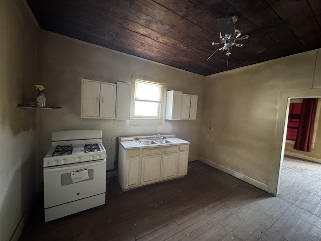 kitchen featuring dark hardwood / wood-style flooring, wooden ceiling, sink, and white range with gas stovetop
