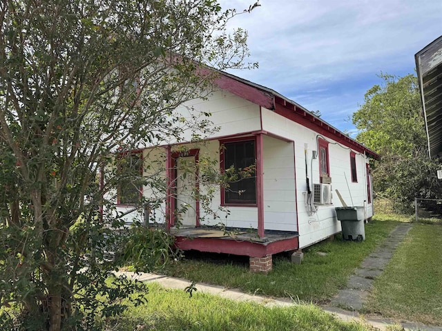 view of side of home with cooling unit