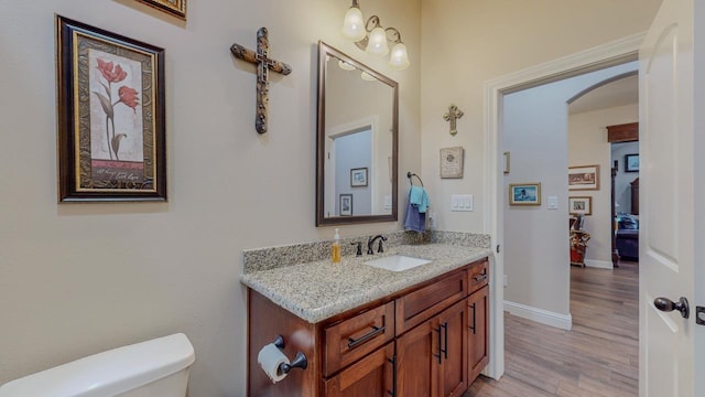 15360 Hercules Dr, Beaumont, TX 77713 - half bath with vanity and wood finished floors