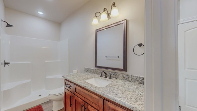 15360 Hercules Dr, Beaumont, TX 77713 - full bathroom featuring a shower, vanity, wood finished floors, and recessed lighting