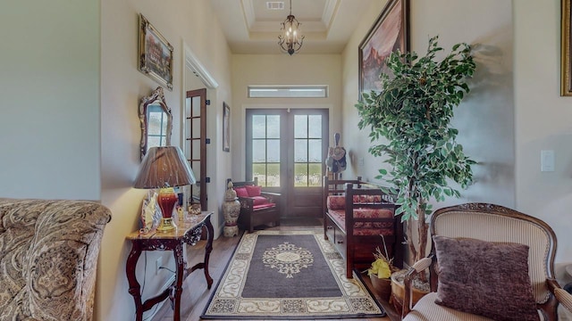 15360 Hercules Dr, Beaumont, TX 77713 - doorway to outside featuring crown molding, french doors, wood finished floors, and a high ceiling