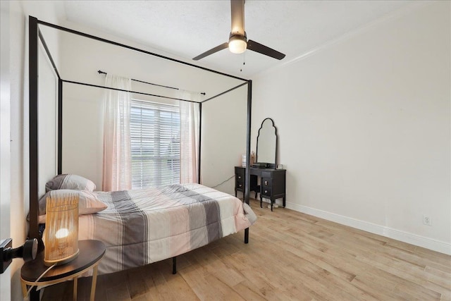 bedroom featuring ceiling fan and light wood-type flooring