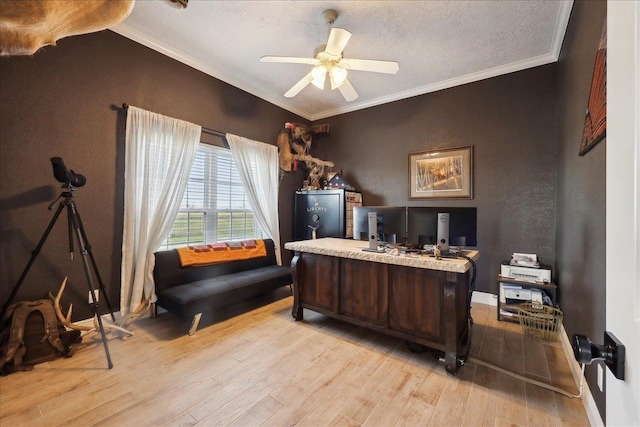 office with crown molding, a textured ceiling, ceiling fan, and light hardwood / wood-style floors