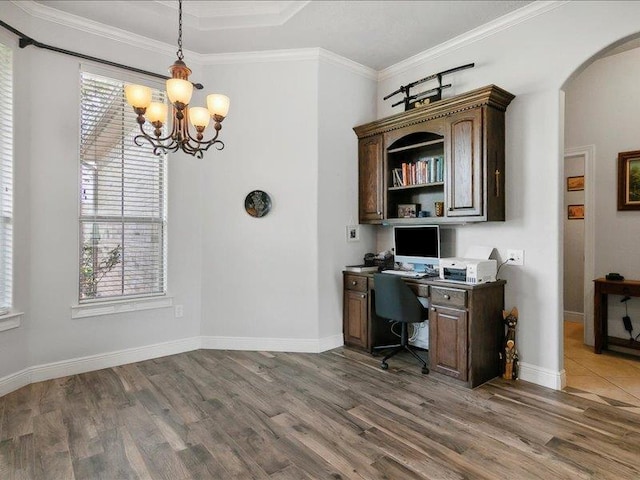 office area with dark hardwood / wood-style floors, crown molding, and a notable chandelier