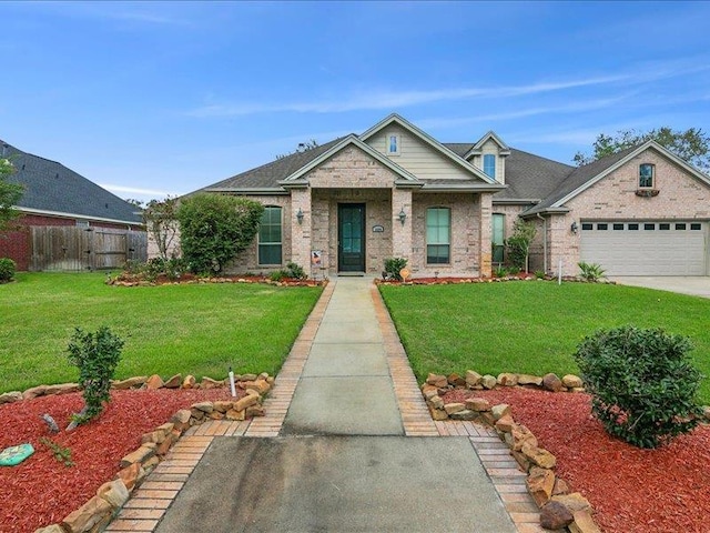 craftsman house with a front yard and a garage