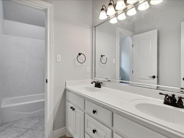 bathroom with tile patterned floors and vanity