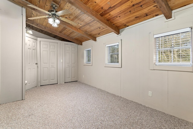 unfurnished bedroom featuring multiple windows, ceiling fan, and carpet