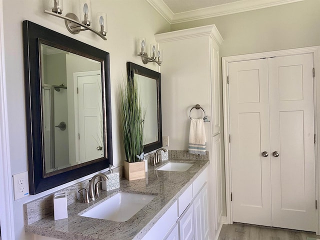 bathroom with walk in shower, vanity, crown molding, hardwood / wood-style flooring, and a chandelier