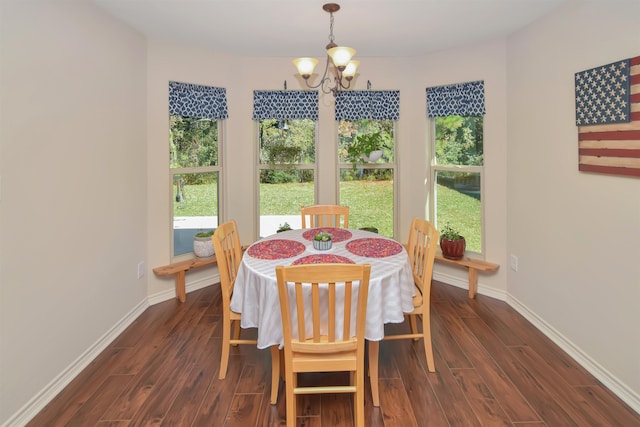 dining room with a notable chandelier and dark hardwood / wood-style floors